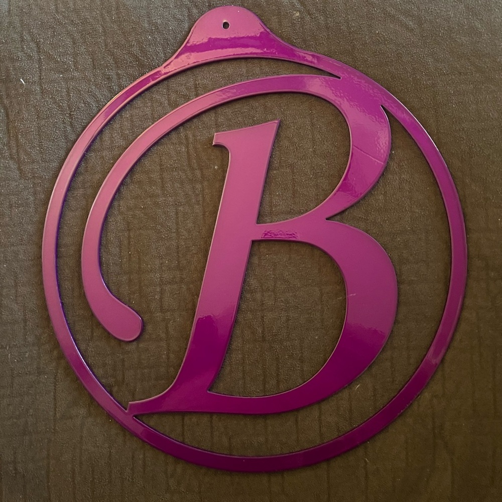 Purple “B” metal sign in good condition!